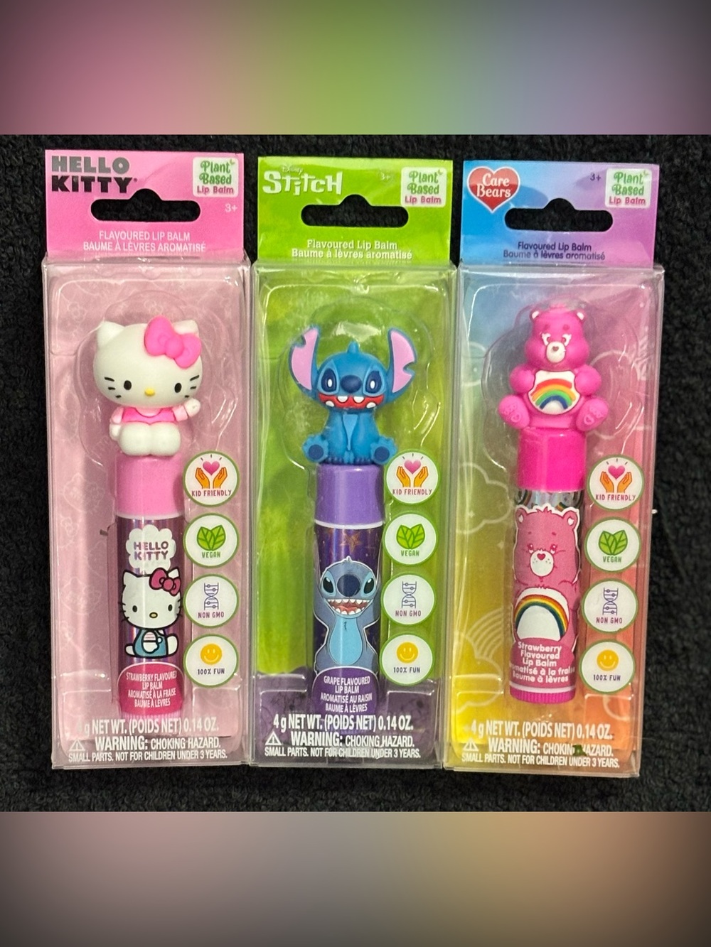3 x Hello Kitty, Stitch and Cheer Bear Character Toppers Flavoured Lip Balms